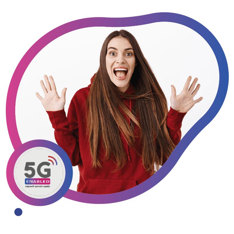 A person with long hair stands confidently with arms crossed, wearing a red hoodie, representing the broad and dependable network coverage provided by eSIM technology in Australia